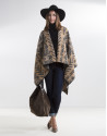 Beige poncho with black trim