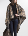 Beige poncho with black trim