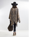 Beige poncho with black trim