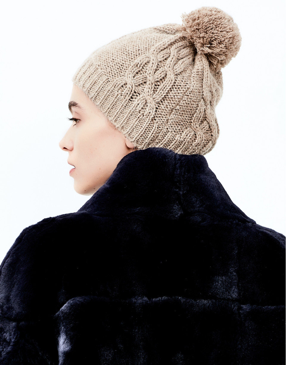 Beige knit cap with pompom