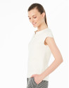 Cream-colored sleeveless top