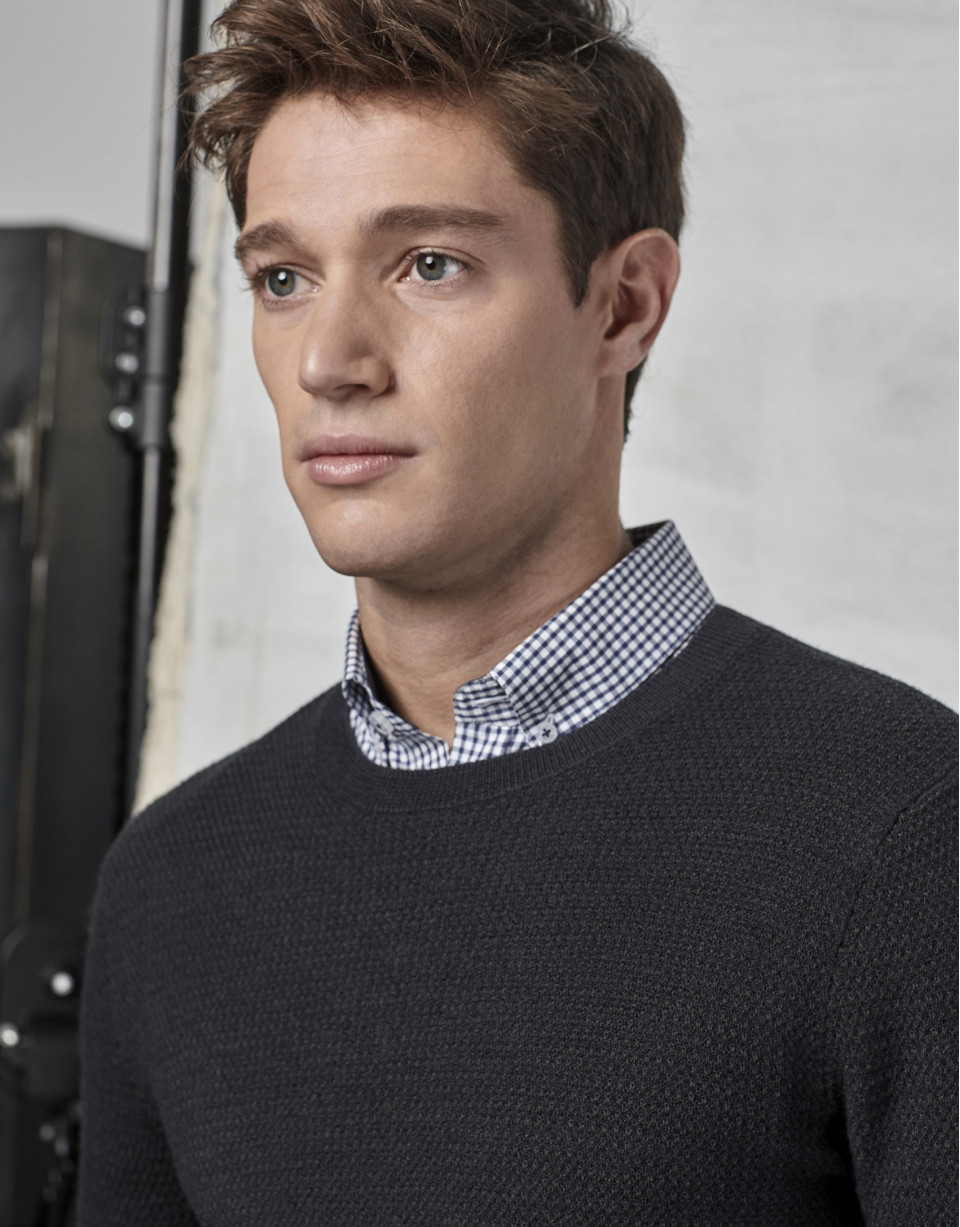 Navy blue sweater with green design