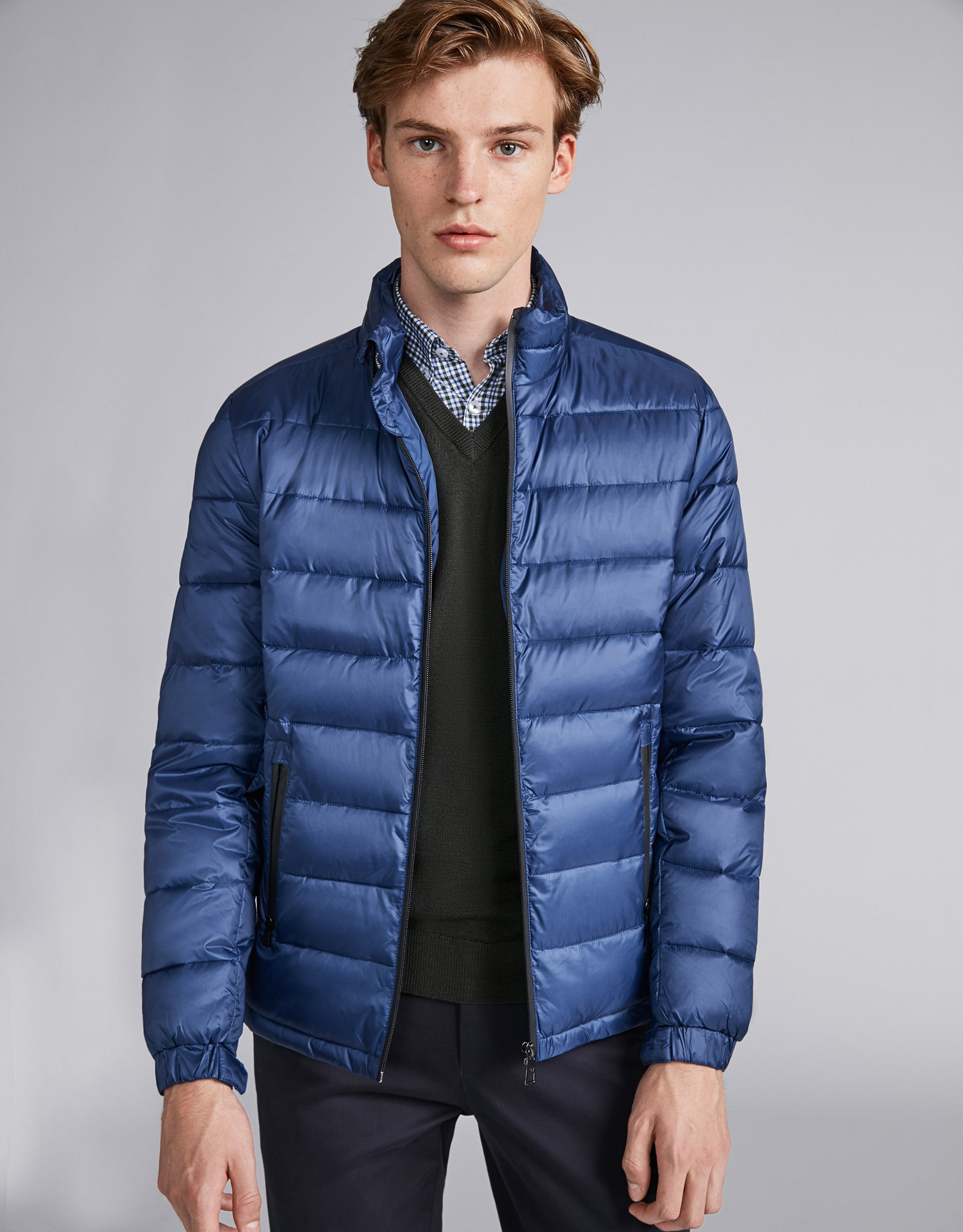 Blue tech ski jacket with details on zippers