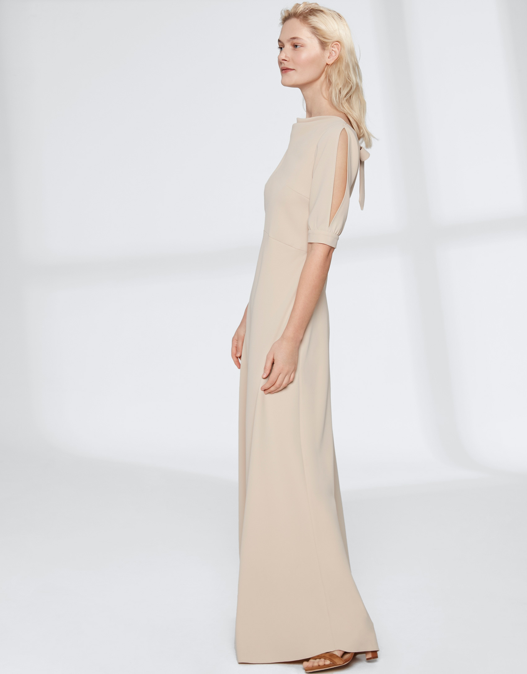 Long, draping, sandy-colored dress 
