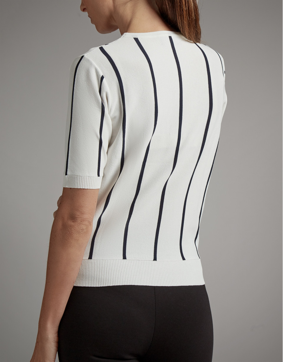 Black and white striped sweater and crossover neckline