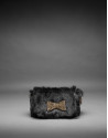 Black rabbit fur Poppy bag with an old gold crystal bow