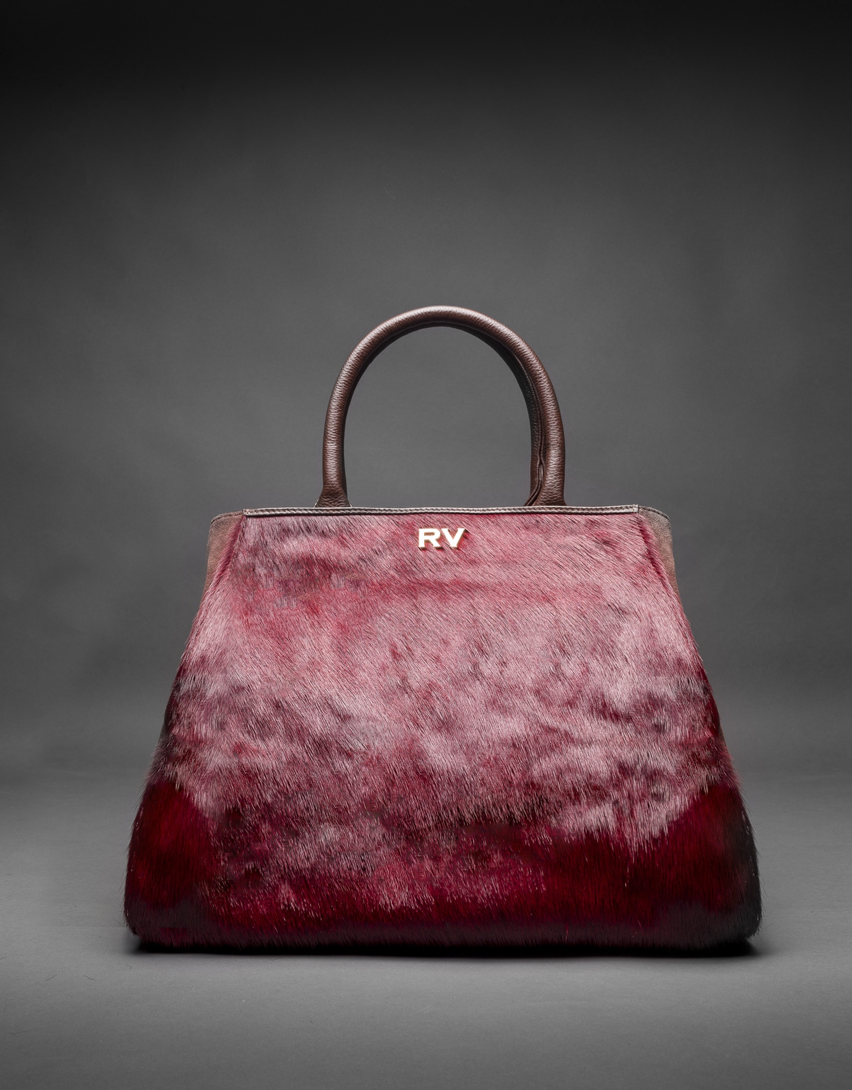 Bolso Justin con pelo de potro en burdeos combinado con piel y ante en marrón