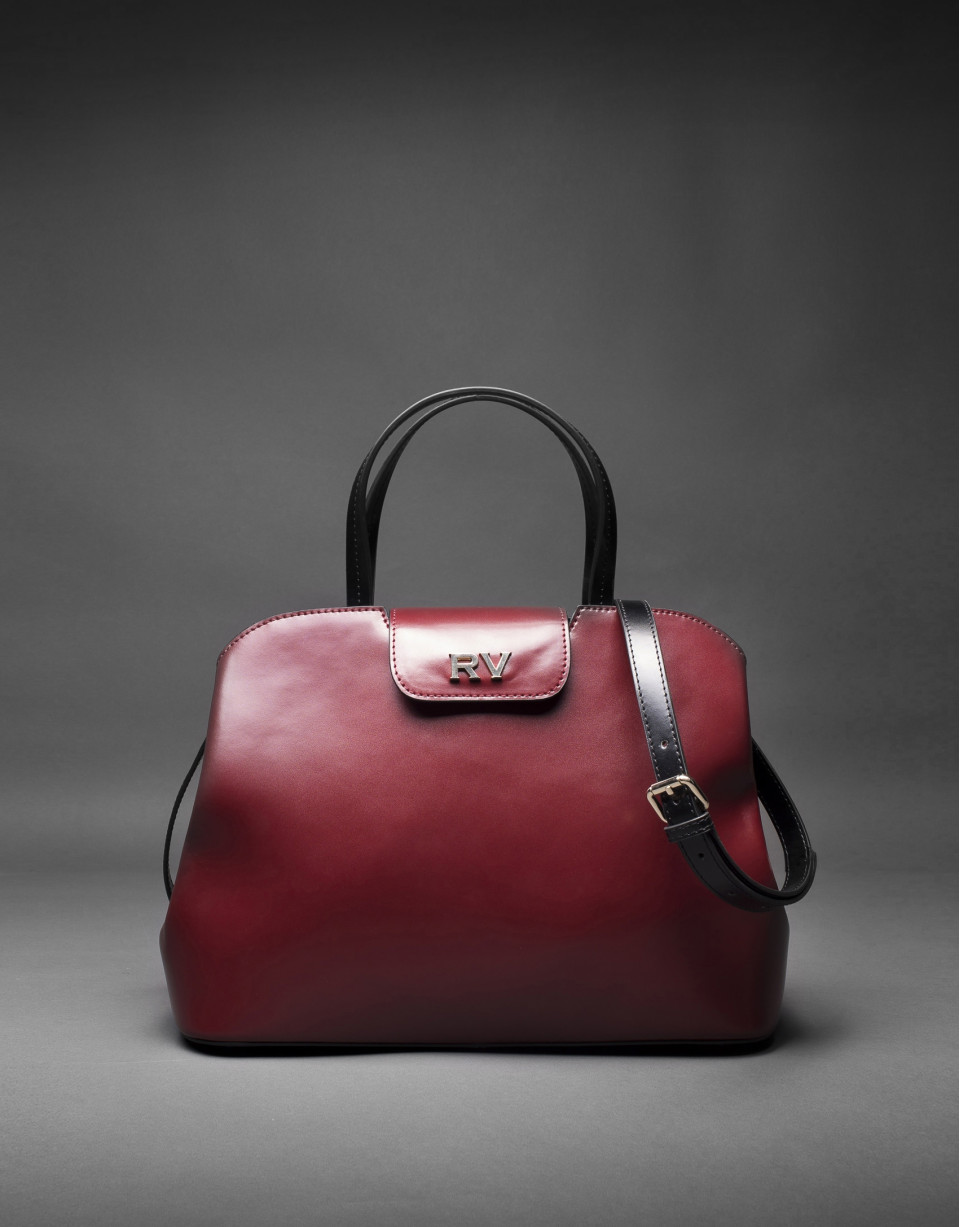 Bolso  Ryan en piel rígida burdeos combinada con negro