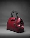 Bolso  Ryan en piel rígida burdeos combinada con negro