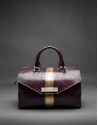 Burgundy leather Carmen Andromeda bag with embossed snake and old gold stripe
