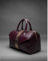 Burgundy leather Carmen Andromeda bag with embossed snake and old gold stripe