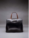 Stiff leather, black and brown Ryan bag 