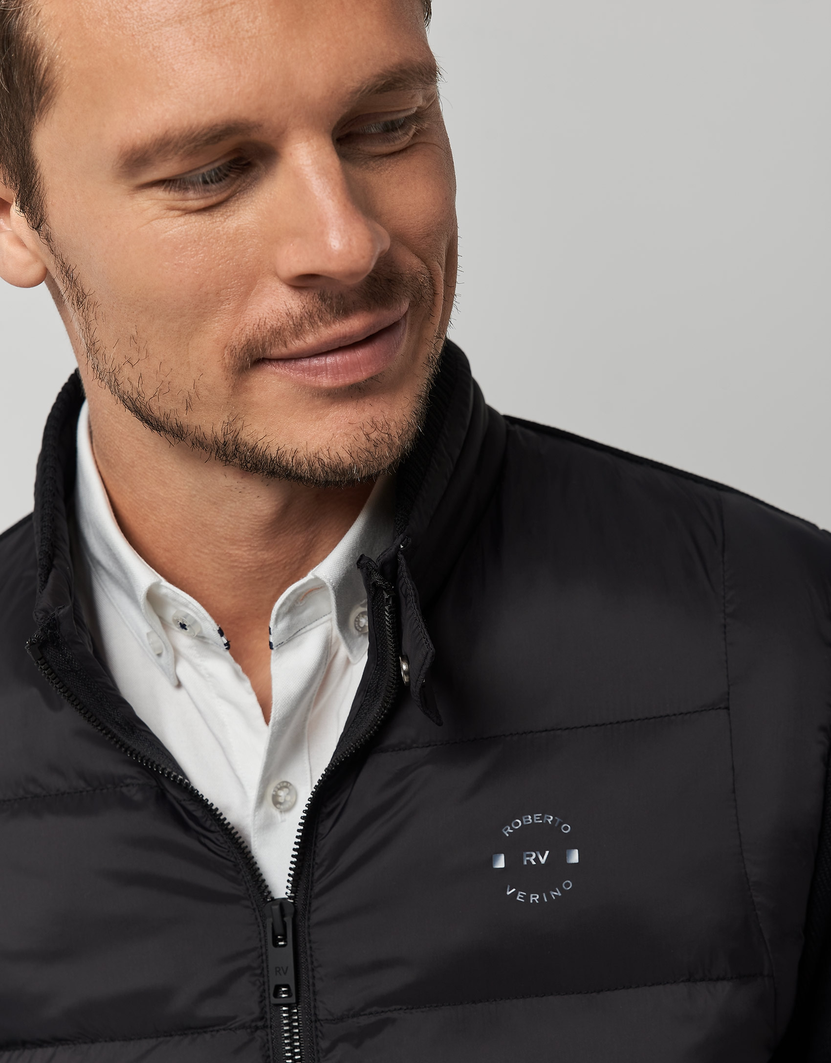 Black quilted windbreaker with knit sleeves | Roberto Verino