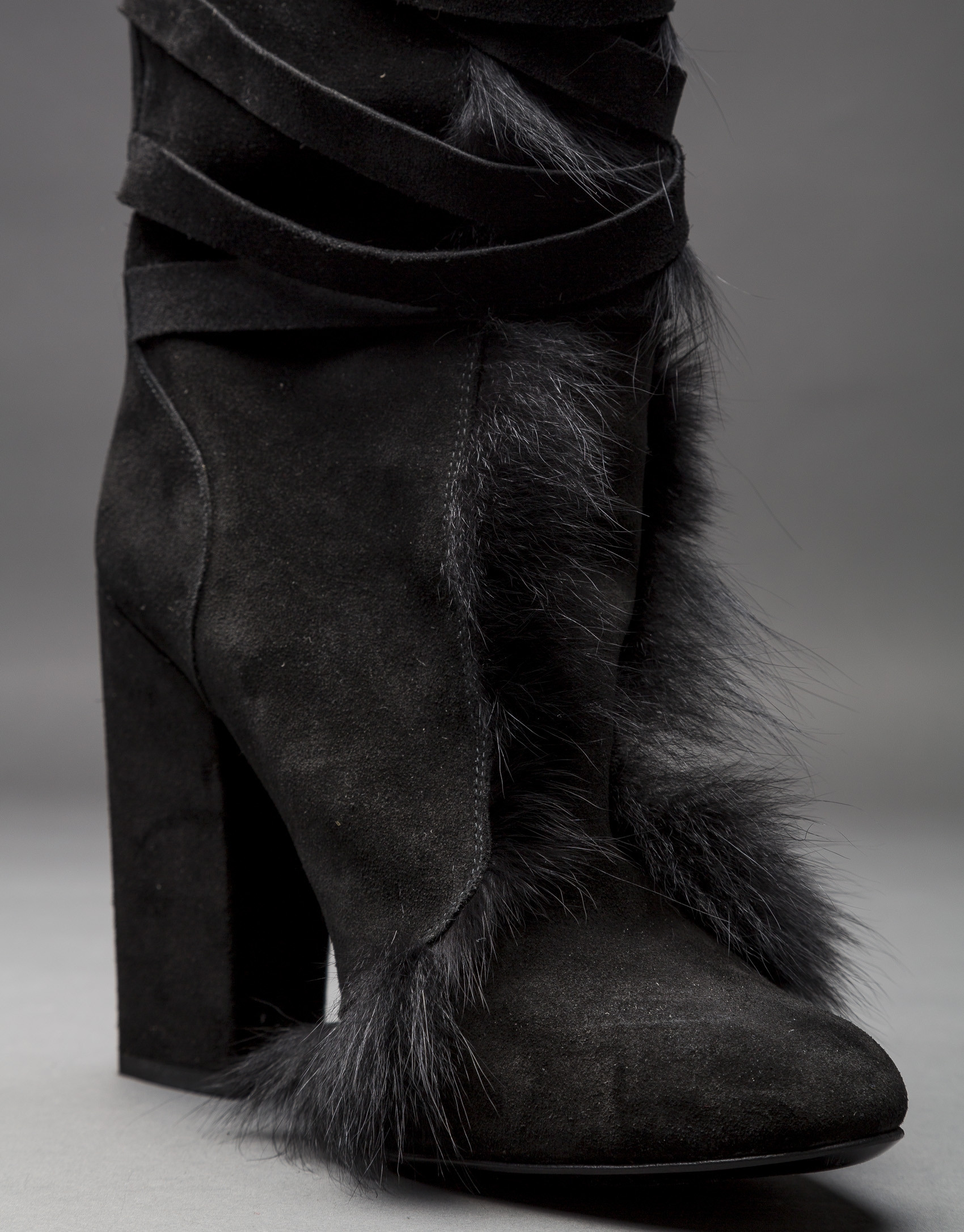 Black suede and fox fur boots.