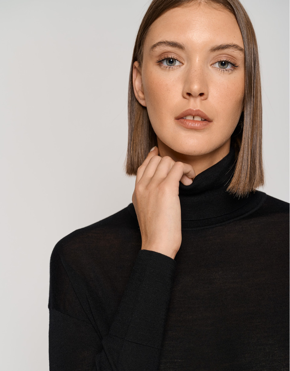 Black fine gauge knit sweater with cowl neckline
