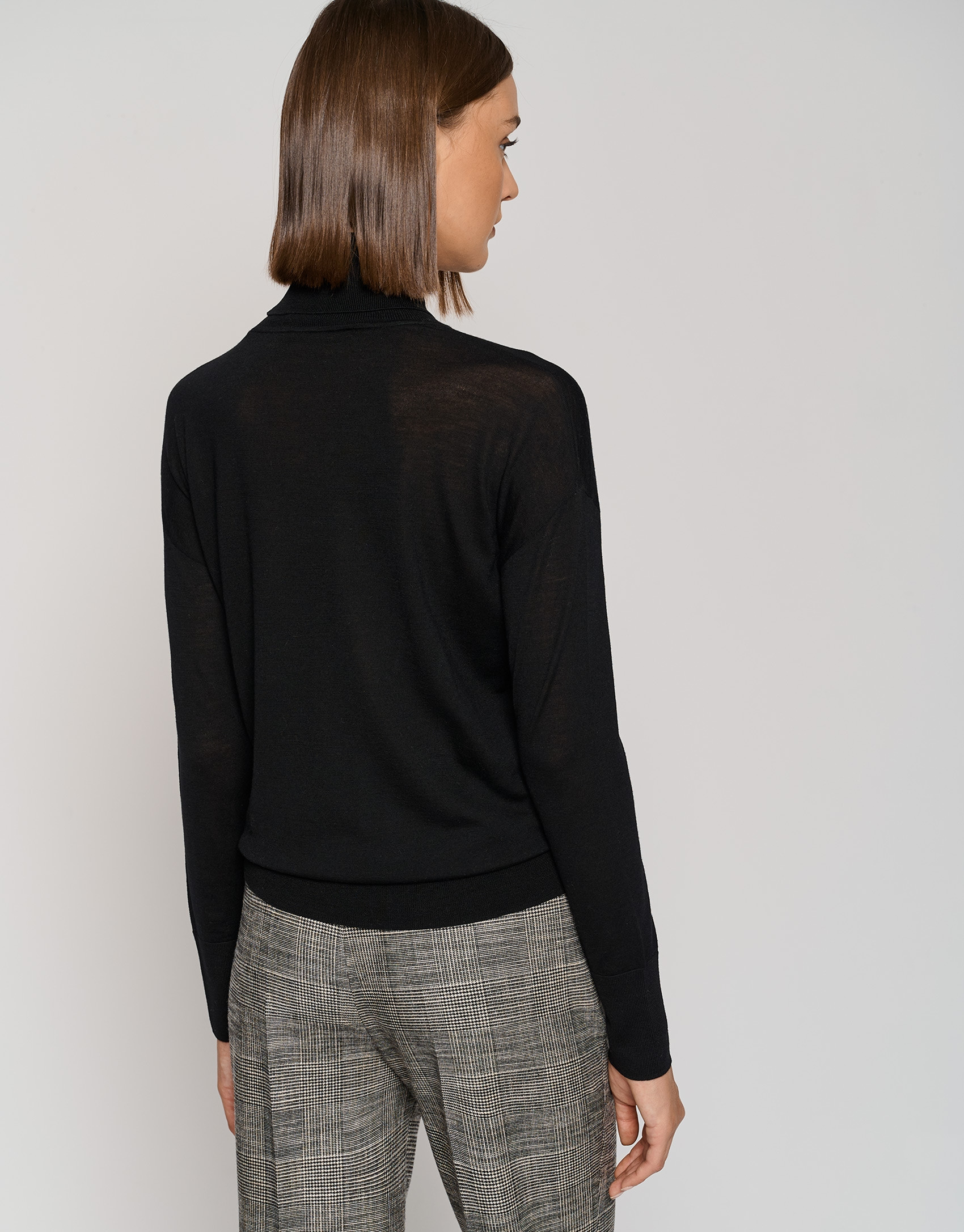 Black fine gauge knit sweater with cowl neckline