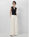 Wide-leg trousers with pleats in off-white ... | Roberto Verino