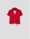 Short sleeveless jacket in red floral piqué ... | Roberto Verino