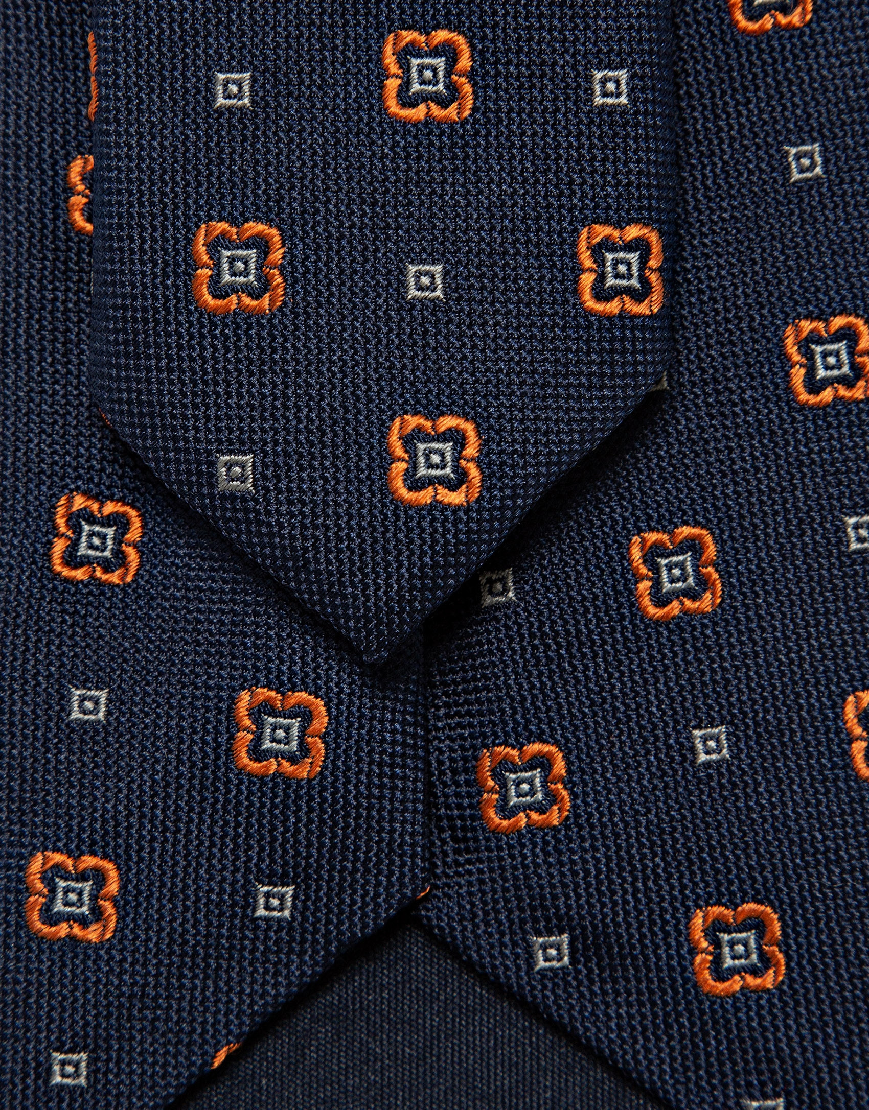 Navy silk tie with geometric orange flower ... | Roberto Verino