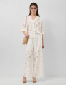 White devoré palazzo trousers with floral print | Roberto Verino