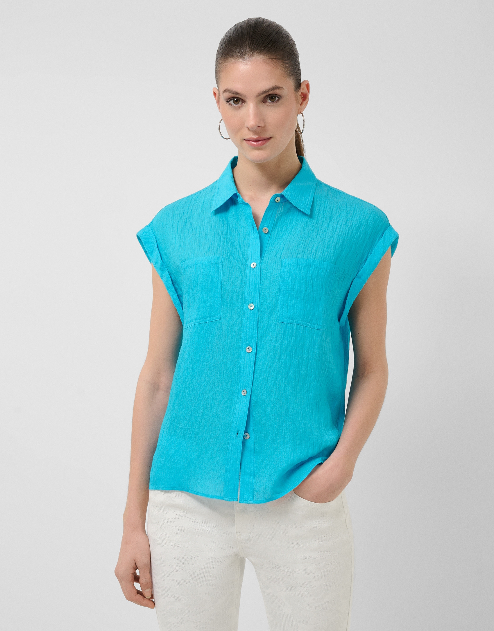 Blusa sin mangas y con bolsillos azul turquesa | Roberto Verino