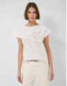 Oversized white sleeveless T-shirt with stars... | Roberto Verino