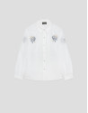Camisa blanca con bordados azules en hombros | Roberto Verino