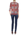 Red print V-neck blouse with tuckered cuffs