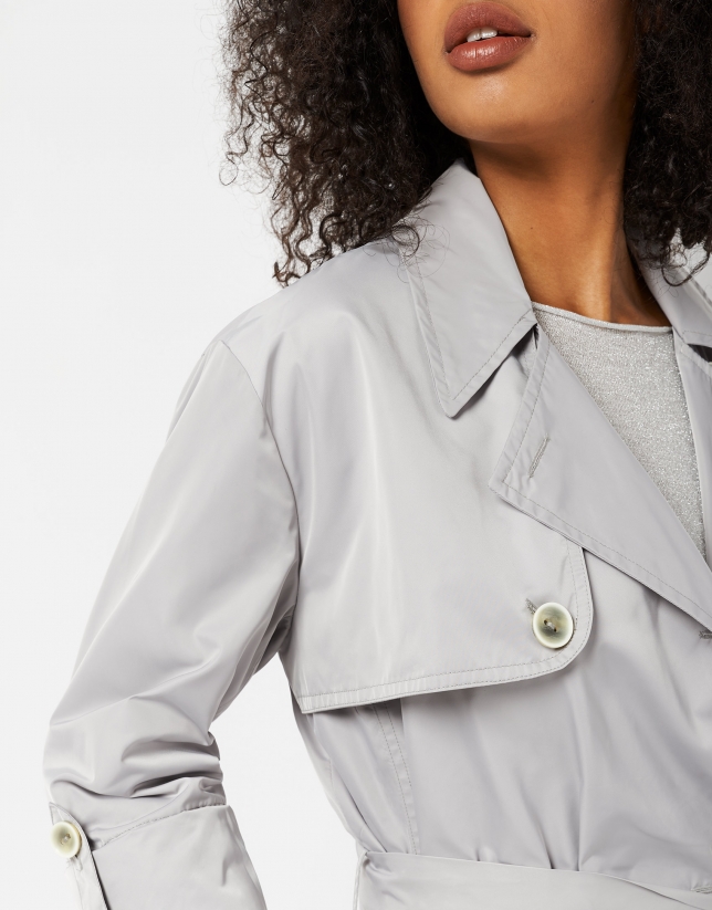 Light gray raincoat with double row of buttons