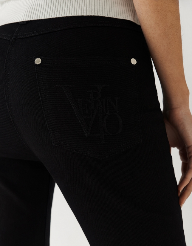 Five-pocket black denim trousers