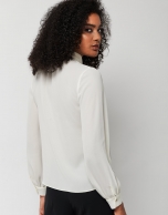 Beige blouse with V-neck and bow