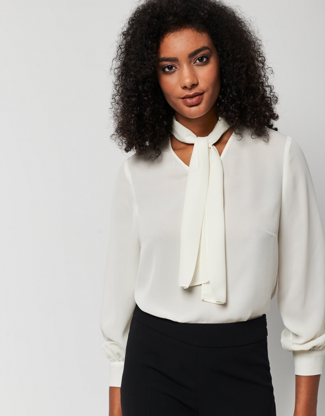 Beige blouse with V-neck and bow