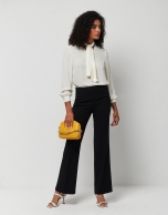 Beige blouse with V-neck and bow