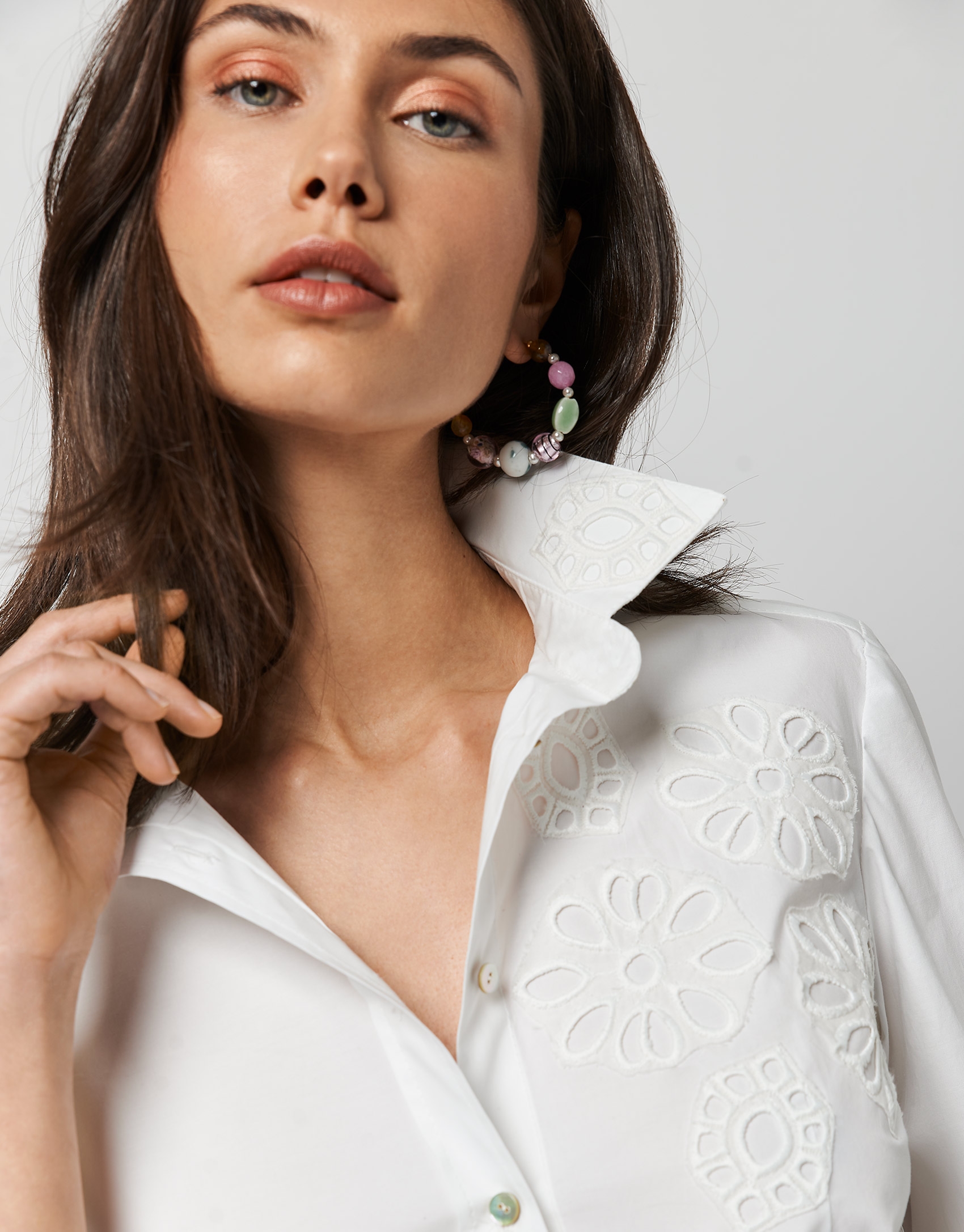 White cotton shirt with embroidered flowers in the front