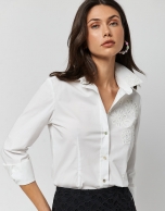 White cotton shirt with embroidered flowers in the front