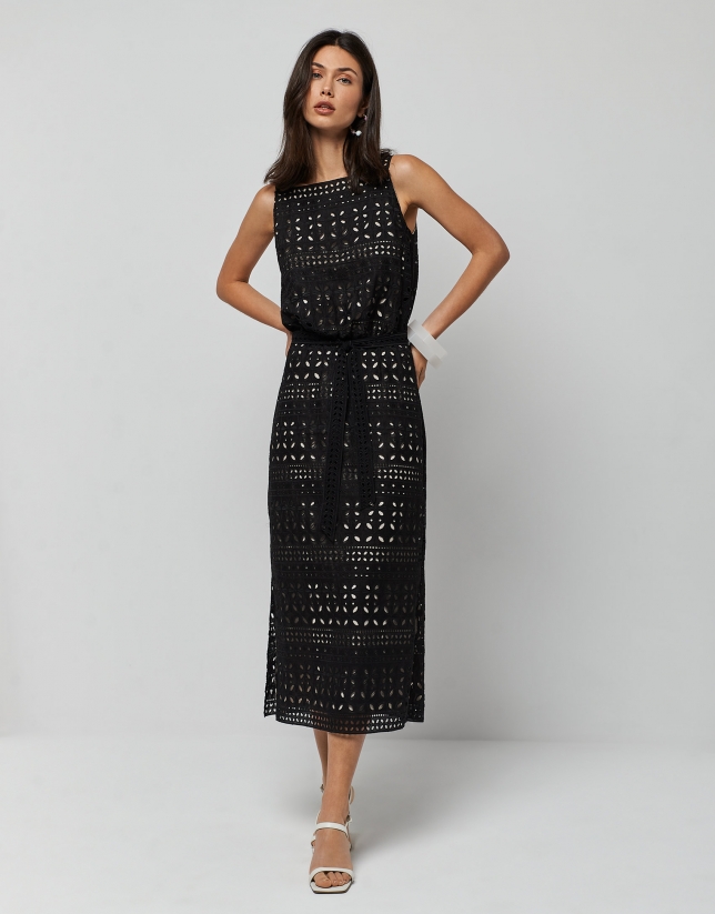 Black sleeveless dress with openwork fabric