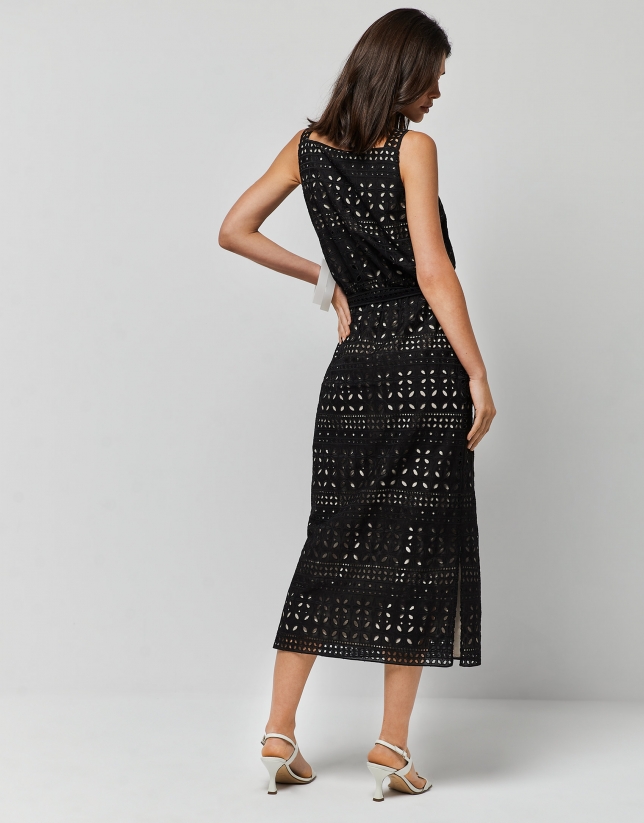 Black sleeveless dress with openwork fabric