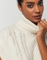 Beige knit vest with turtleneck