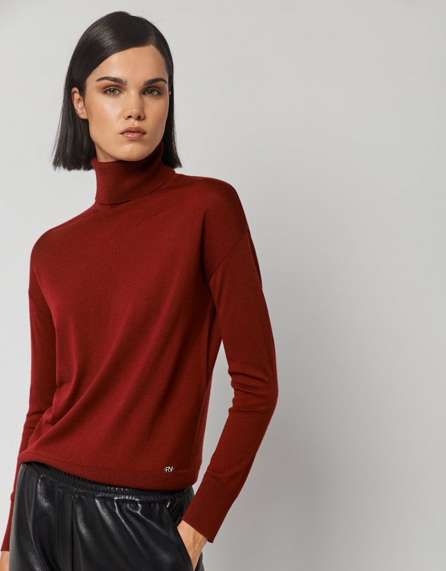 Burgundy fine knit sweater with turtleneck.