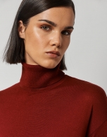 Burgundy fine knit sweater with turtleneck.
