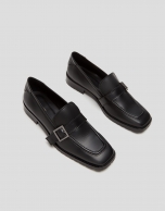 Black leather moccasins
