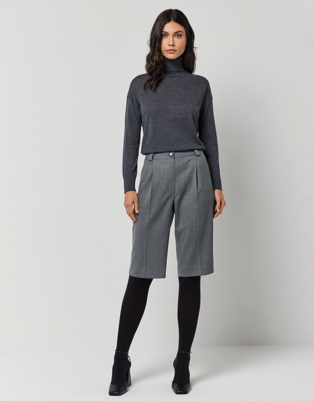Dark grey fine knit sweater with turtleneck.