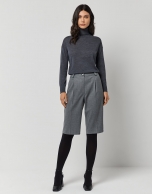 Dark grey fine knit sweater with turtleneck.