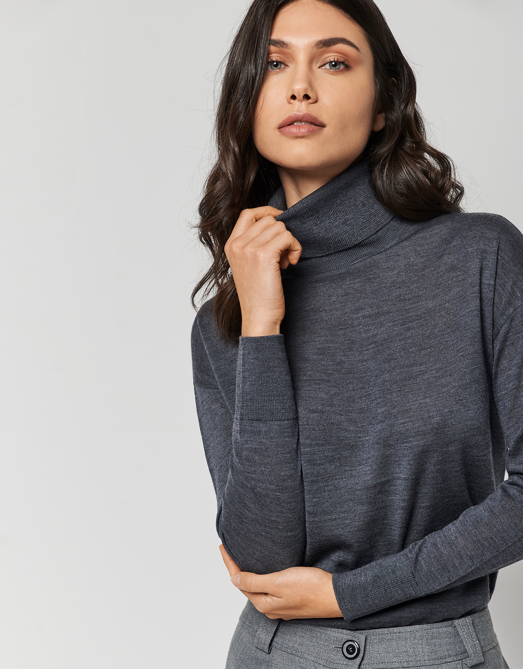 Dark grey fine knit sweater with turtleneck.