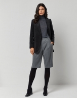 Dark grey fine knit sweater with turtleneck.