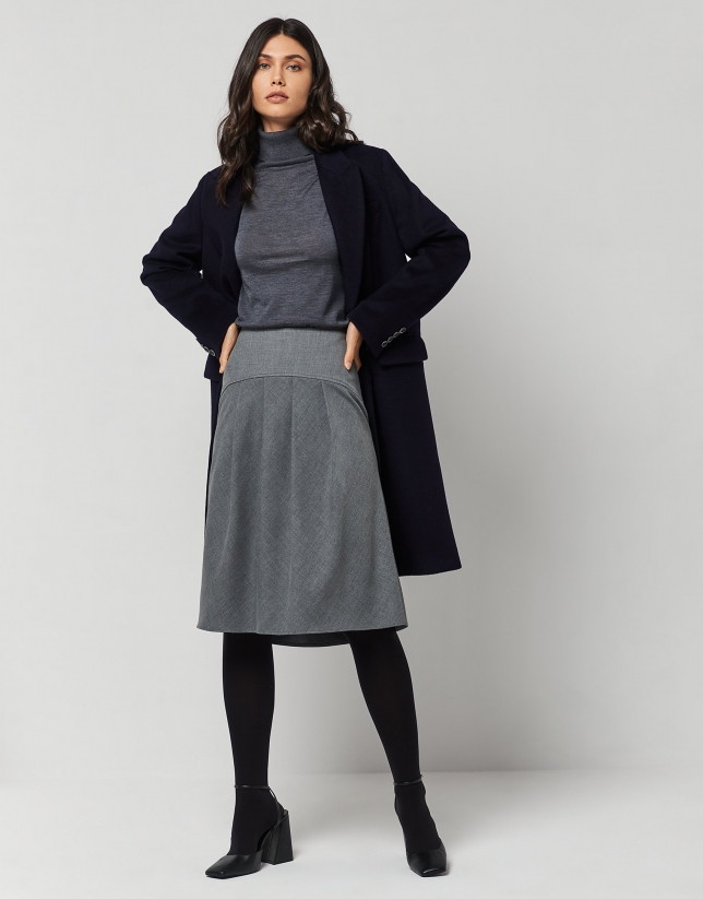 Dark grey fine knit sweater with turtleneck.