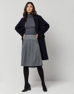 Dark grey fine knit sweater with turtleneck.