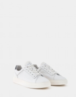 White trainers with blue heel