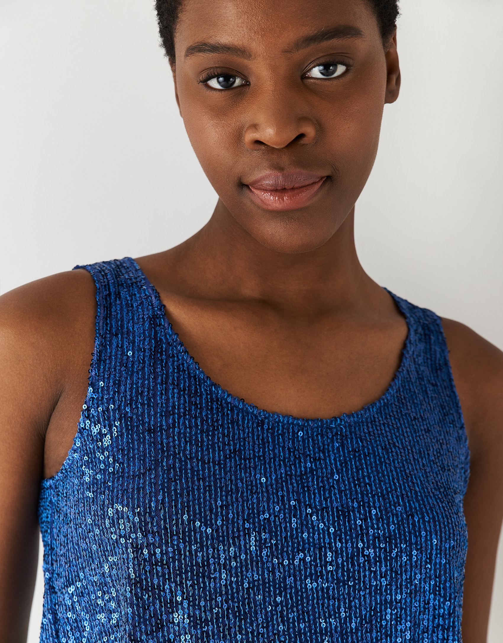 Blue sleeveless top with sequins