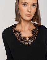 Black ribbed sweater with lace and V-neck
